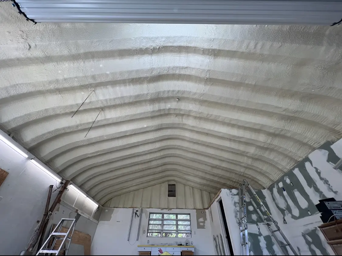 Spray polyurethane foam applied to the underside of a metal roof deck in Lower Southampton